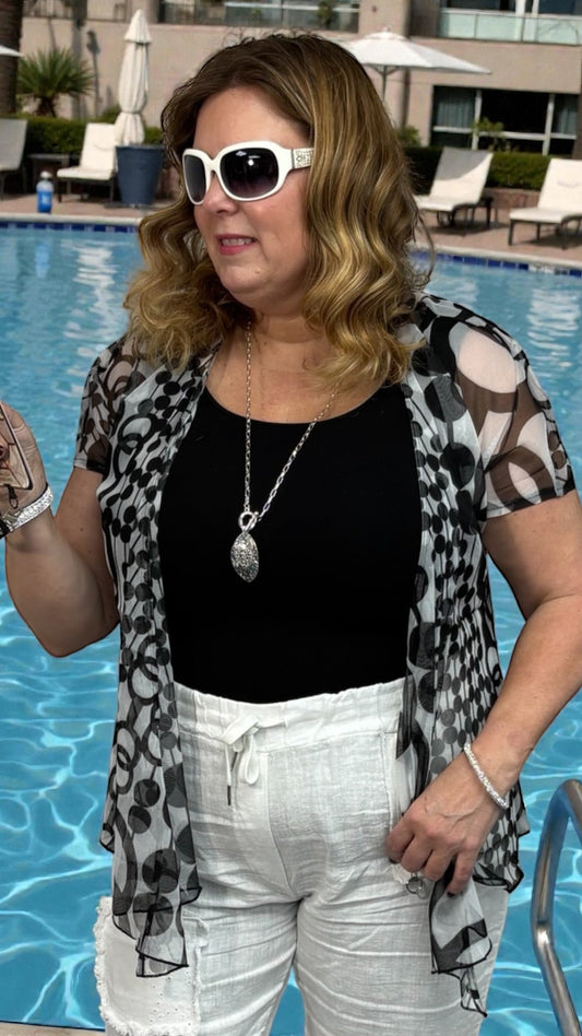 Black and white short sleeve bolero, stretchy and lightweight, perfect for effortless layering and travel