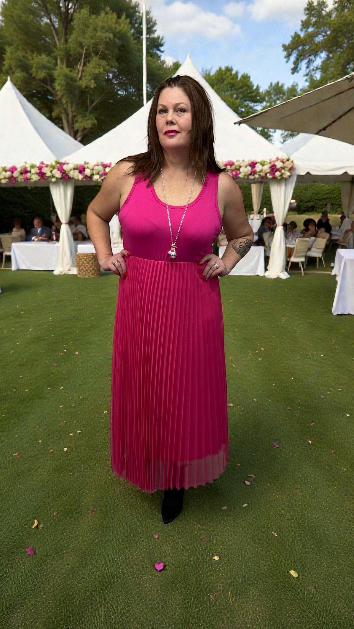 Vibrant pink dress with an easy, flattering silhouette styled for casual and everyday wear